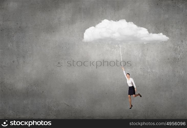 Young determined businesswoman flying high in sky on cloud. Flying woman
