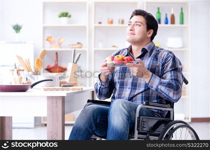 Young disabled husband preparing food salad