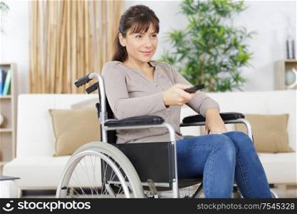 young disabled lady using remote control