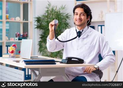 Young doctor cardiologist working in the clinic 