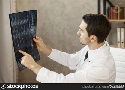young doctor checking radiography
