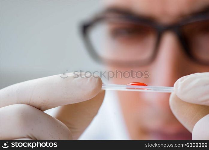Young doctor doing the blood test