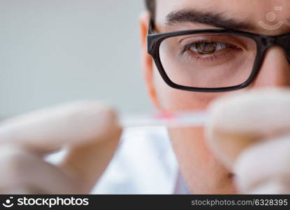 Young doctor doing the blood test