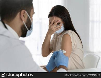 young doctor doing vaccine frightened patient