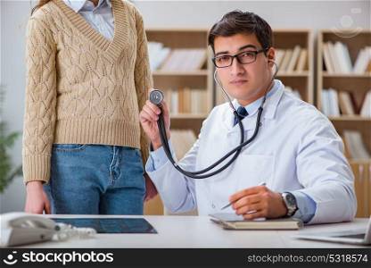 Young doctor examining patient with stethoscope