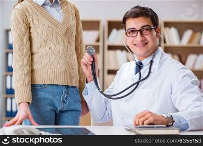 Young doctor examining patient with stethoscope