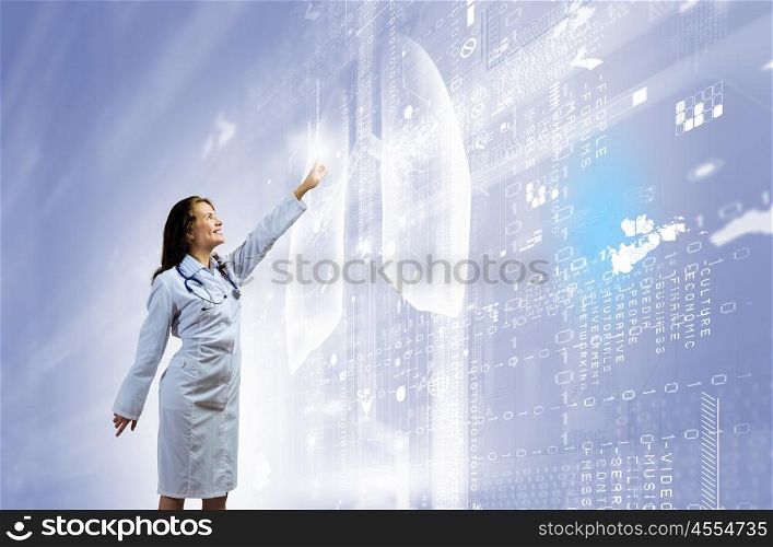 Young doctor. Image of young woman doctor touching icon of media screen