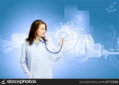 Young doctor. Image of young woman doctor touching icon of media screen