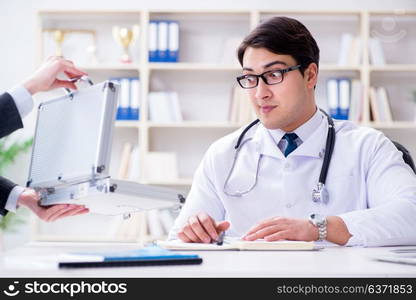 Young doctor in medical insurance fraud concept