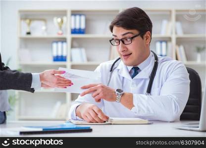 Young doctor in medical insurance fraud concept. The young doctor in medical insurance fraud concept