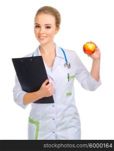 Young doctor in uniform with apple isolated