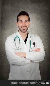 Young doctor isolated on irregular grey background