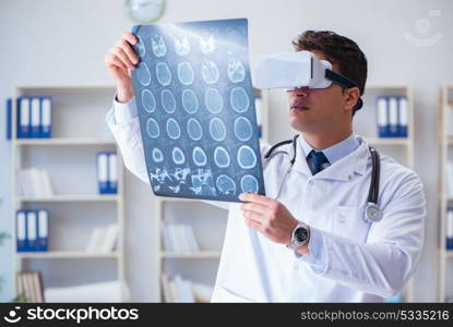 Young doctor looking at MRI scan through VR glasses