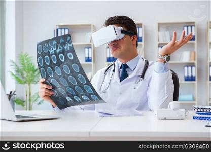 Young doctor looking at MRI scan through VR glasses. The young doctor looking at mri scan through vr glasses