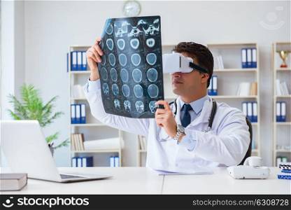 Young doctor looking at MRI scan through VR glasses