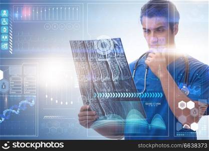 Young doctor looking at x-ray image in mhealth concept