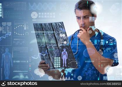 Young doctor looking at x-ray image in mhealth concept. The young doctor looking at x-ray image in mhealth concept
