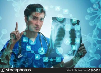 Young doctor looking at x-ray image in mhealth concept