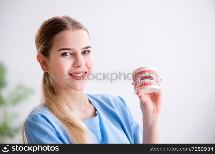 Young doctor nurse with dentures