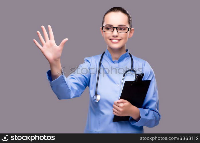 Young doctor pressing virtual button