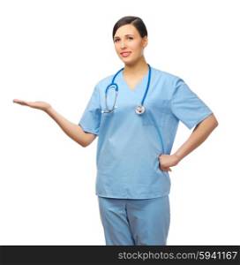 Young doctor showing welcome gesture isolated