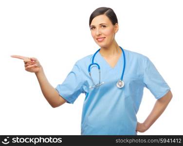 Young doctor shows pointing gesture isolated