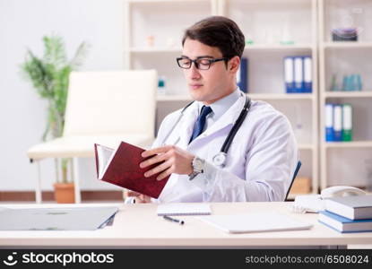 Young doctor sitting in the office