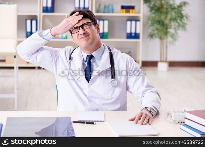 Young doctor sitting in the office