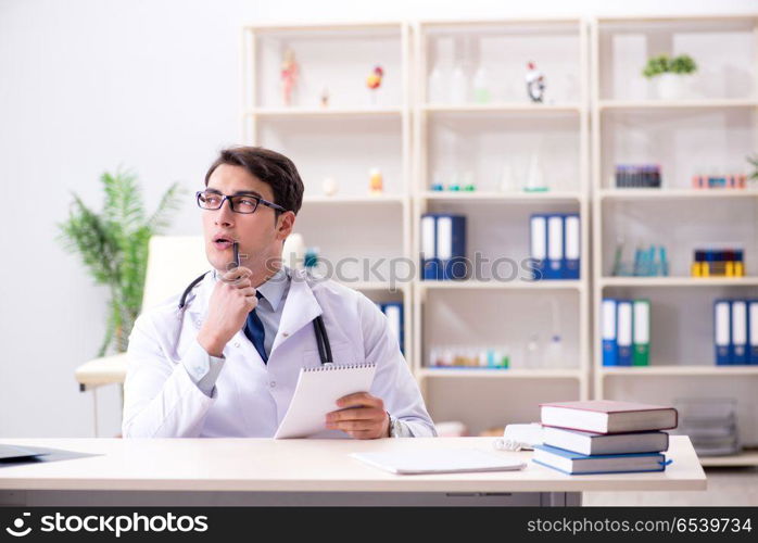 Young doctor sitting in the office