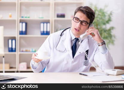 Young doctor sitting in the office