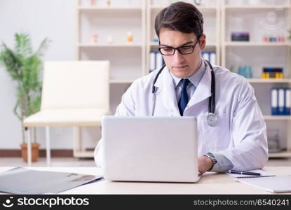 Young doctor sitting in the office