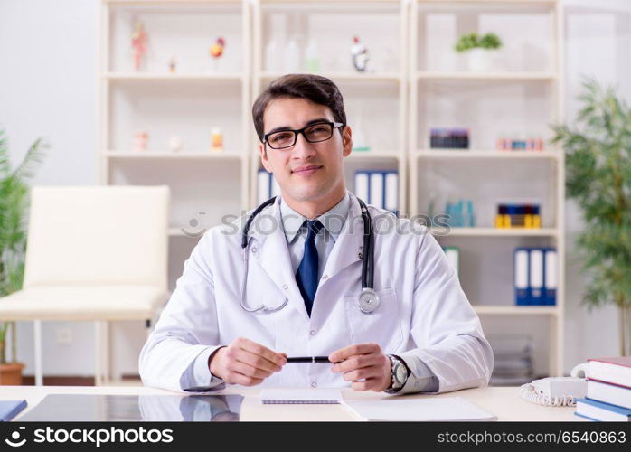 Young doctor sitting in the office