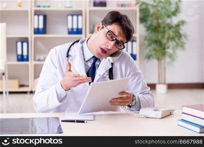 Young doctor sitting in the office