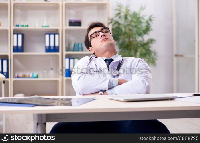 Young doctor sitting in the office