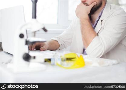 Young Doctor thinking during of using computer