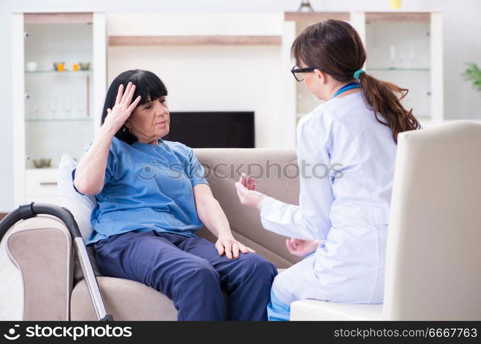 Young doctor visiting old mature woman for check-up