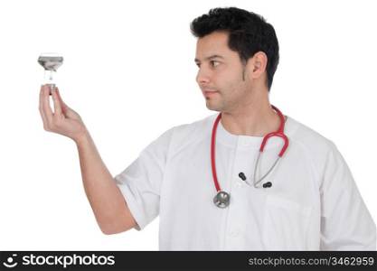 Young doctor with a bulb in the hand isolated on a over white background