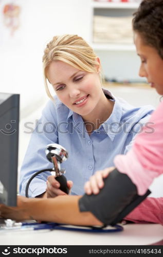 Young doctor with female patient