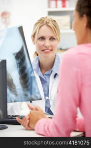 Young doctor with female patient