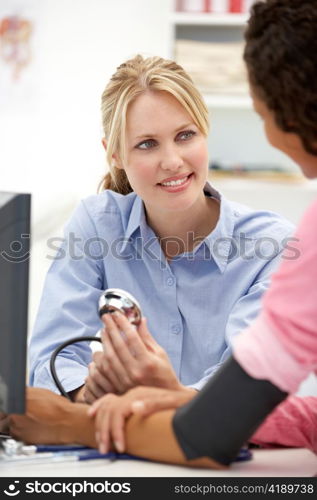 Young doctor with female patient