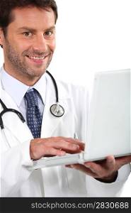 Young doctor with laptop