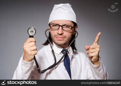 Young doctor with stethoscope in medical concept