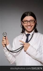 Young doctor with stethoscope in medical concept