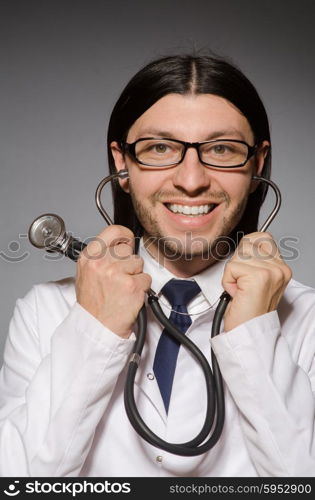 Young doctor with stethoscope in medical concept