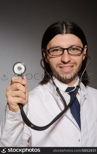 Young doctor with stethoscope in medical concept