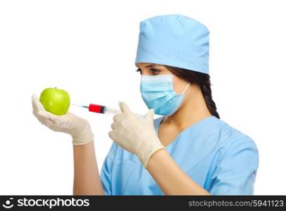 Young doctor with syringe and apple isolated