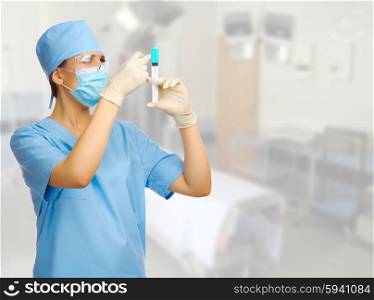 Young doctor with syringe on medical interior