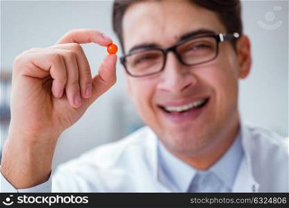 Young doctor with the pill