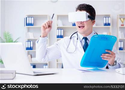 Young doctor with vr virtual reality headset working in the offi. Young doctor with vr virtual reality headset working in the office