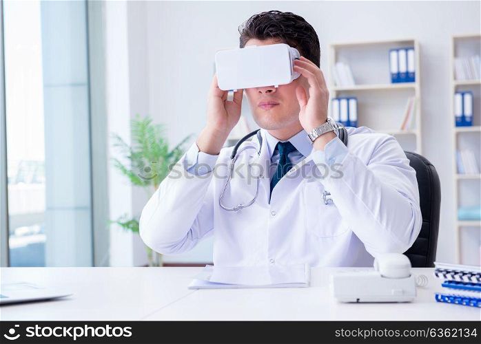Young doctor with vr virtual reality headset working in the offi. Young doctor with vr virtual reality headset working in the office